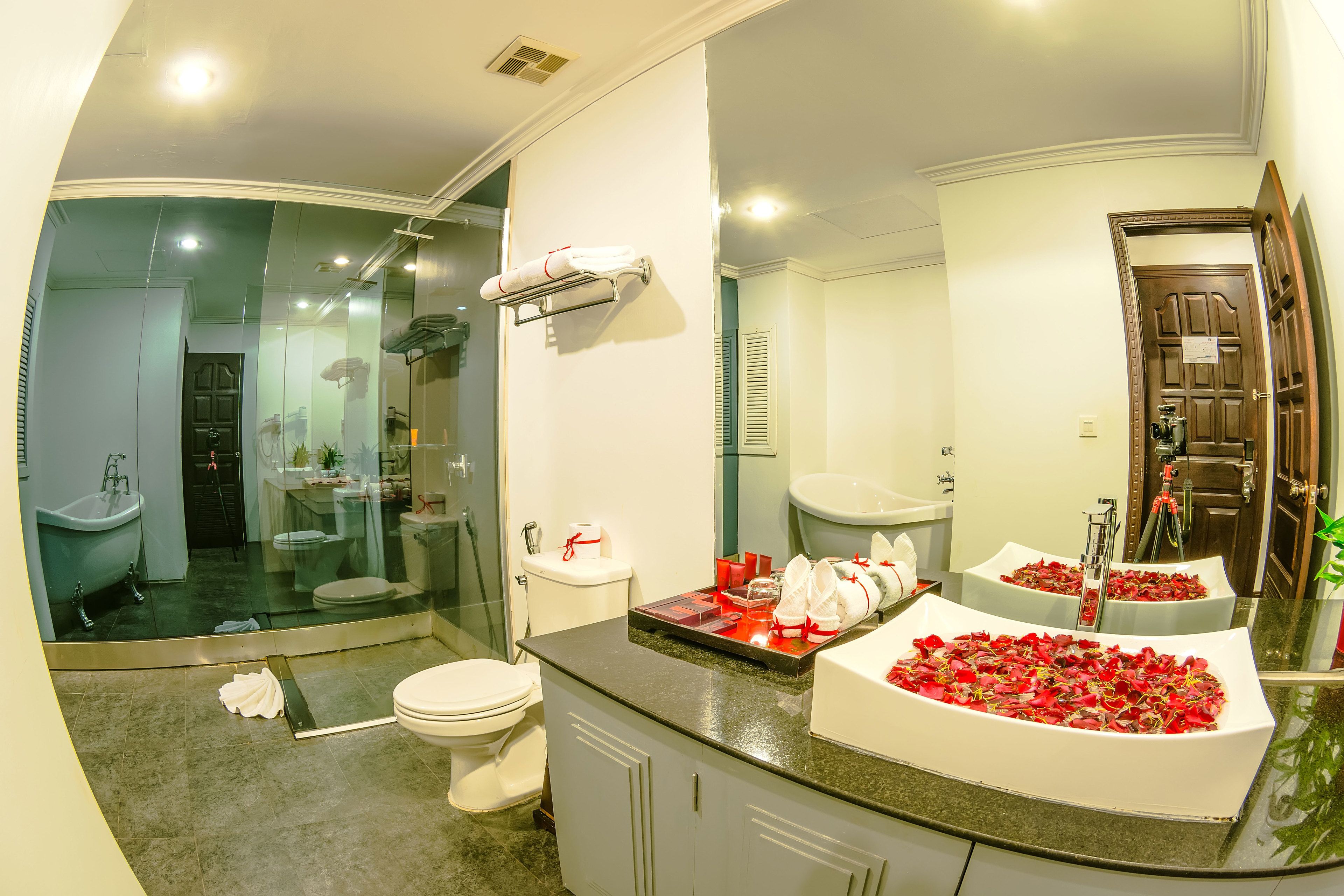 separate bathtub and shower, rainfall showerhead, designer toiletries