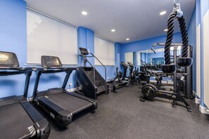 A gym with treadmills, a stair climber, and a cable machine. - The Ellison Hotel (Castlebar)