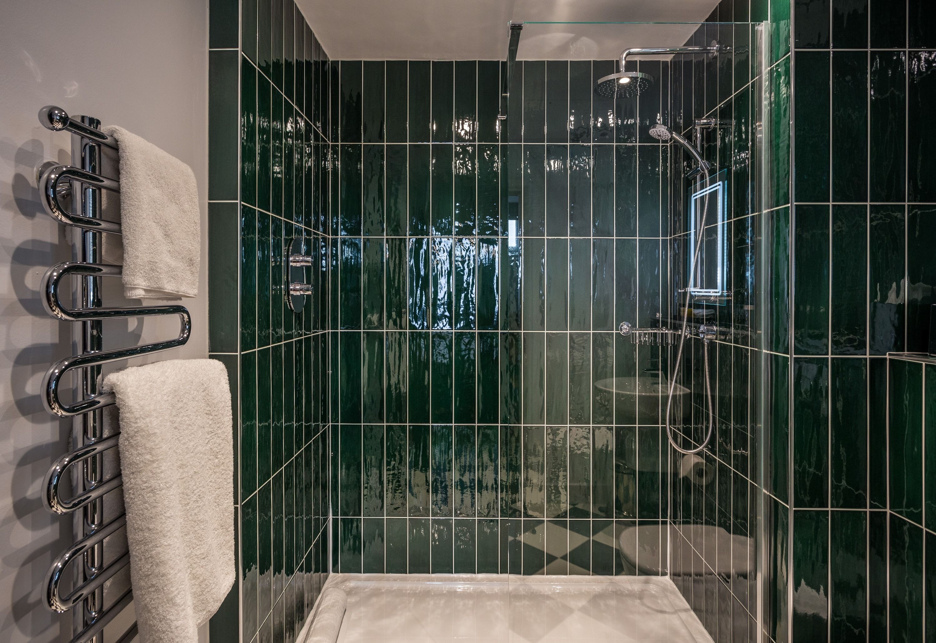 designer toiletries, hair dryer, towels