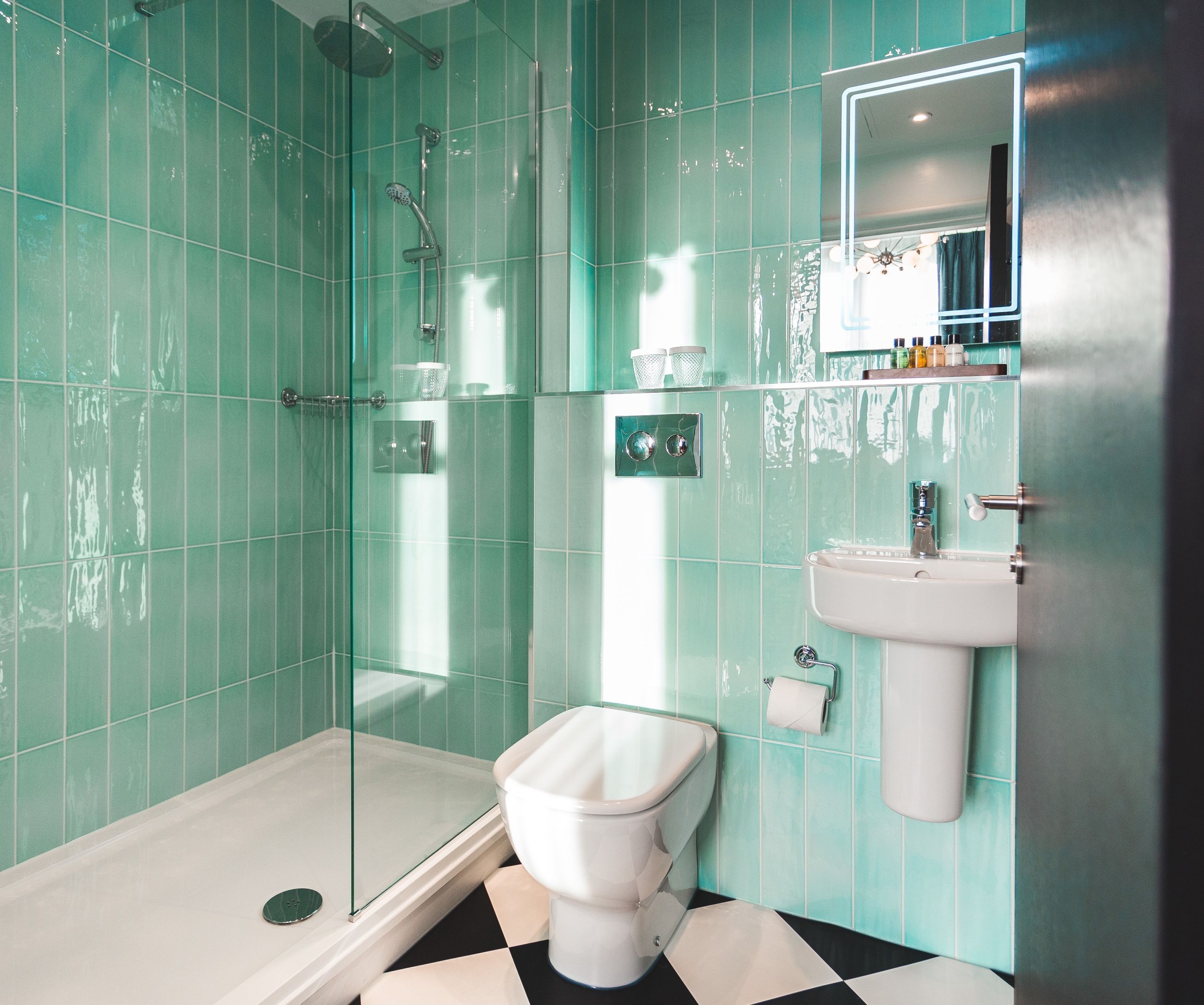 designer toiletries, hair dryer, towels