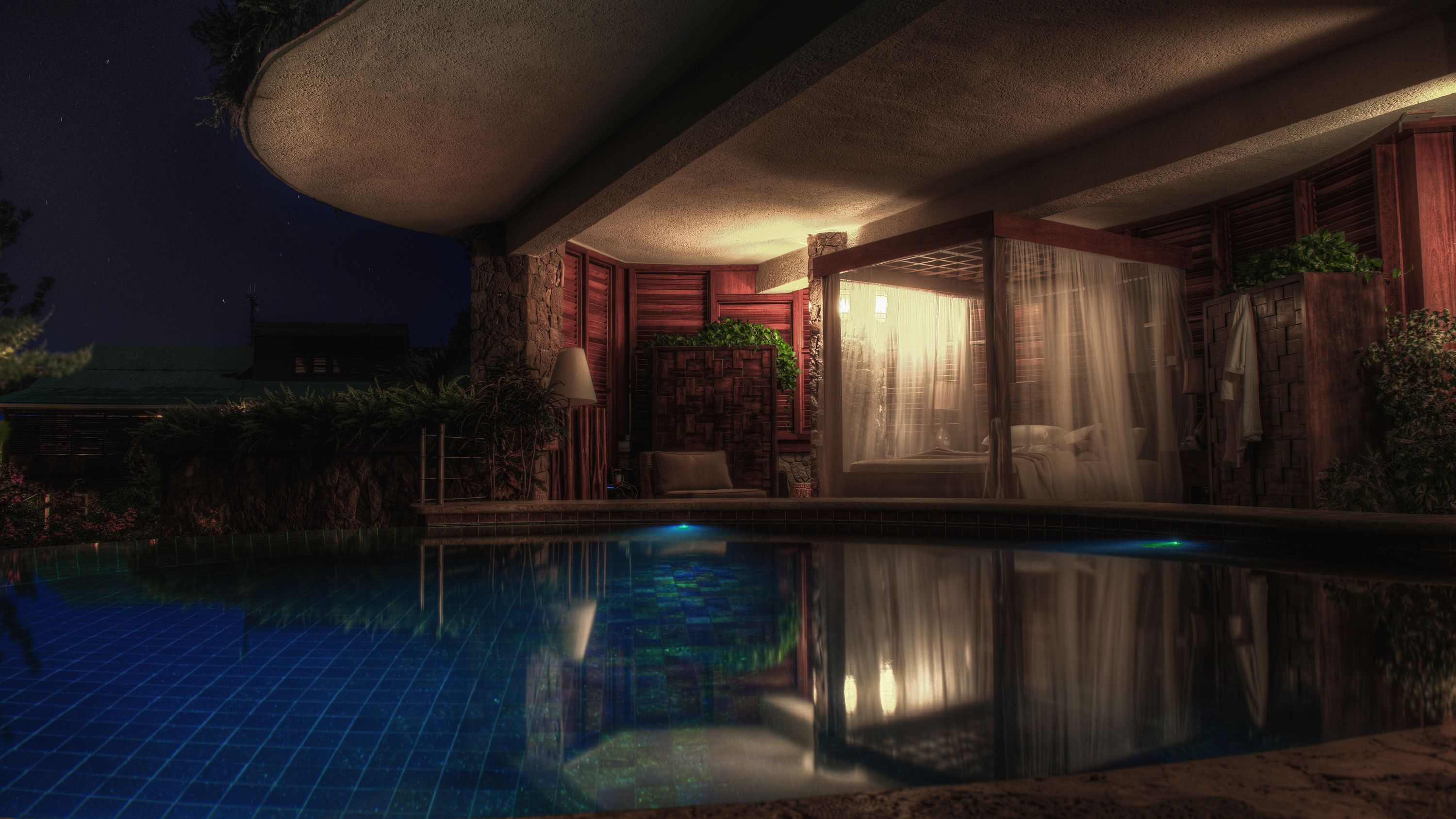 Vista nocturna de un área de piscina con una estructura de piedra, una silla de descanso y una ventana con cortinas.