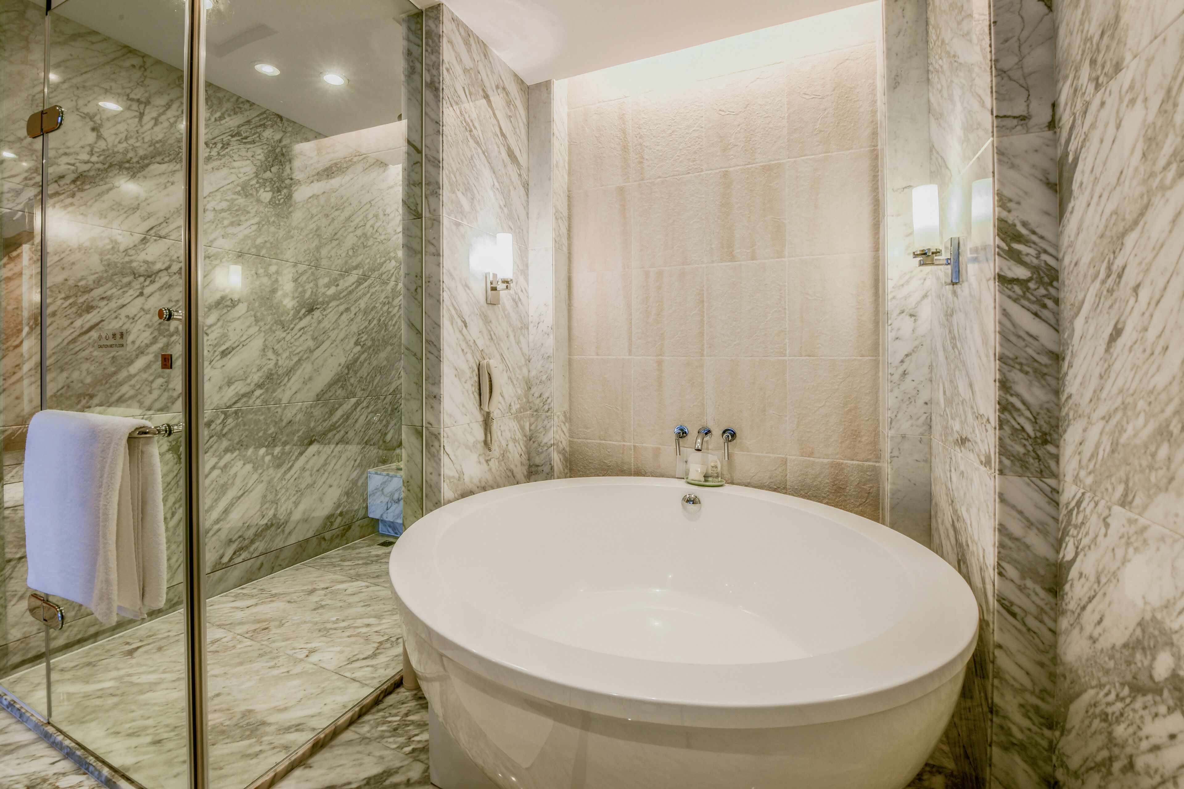 separate bathtub and shower, hair dryer, bathrobes, slippers