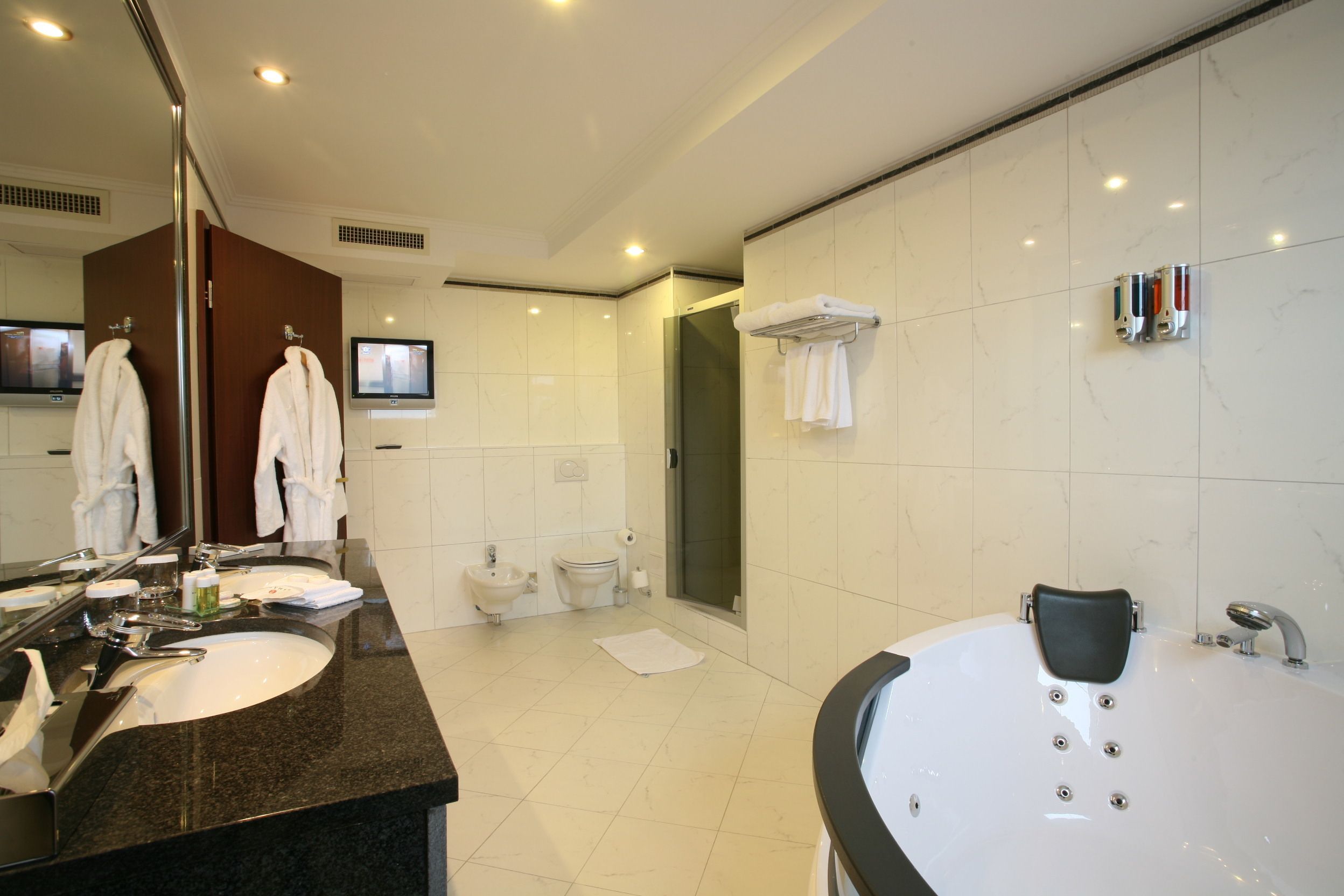 upgraded, suite, 1 king bed, non smoking | bathroom | bathtub, free toiletries, hair dryer, bathrobes