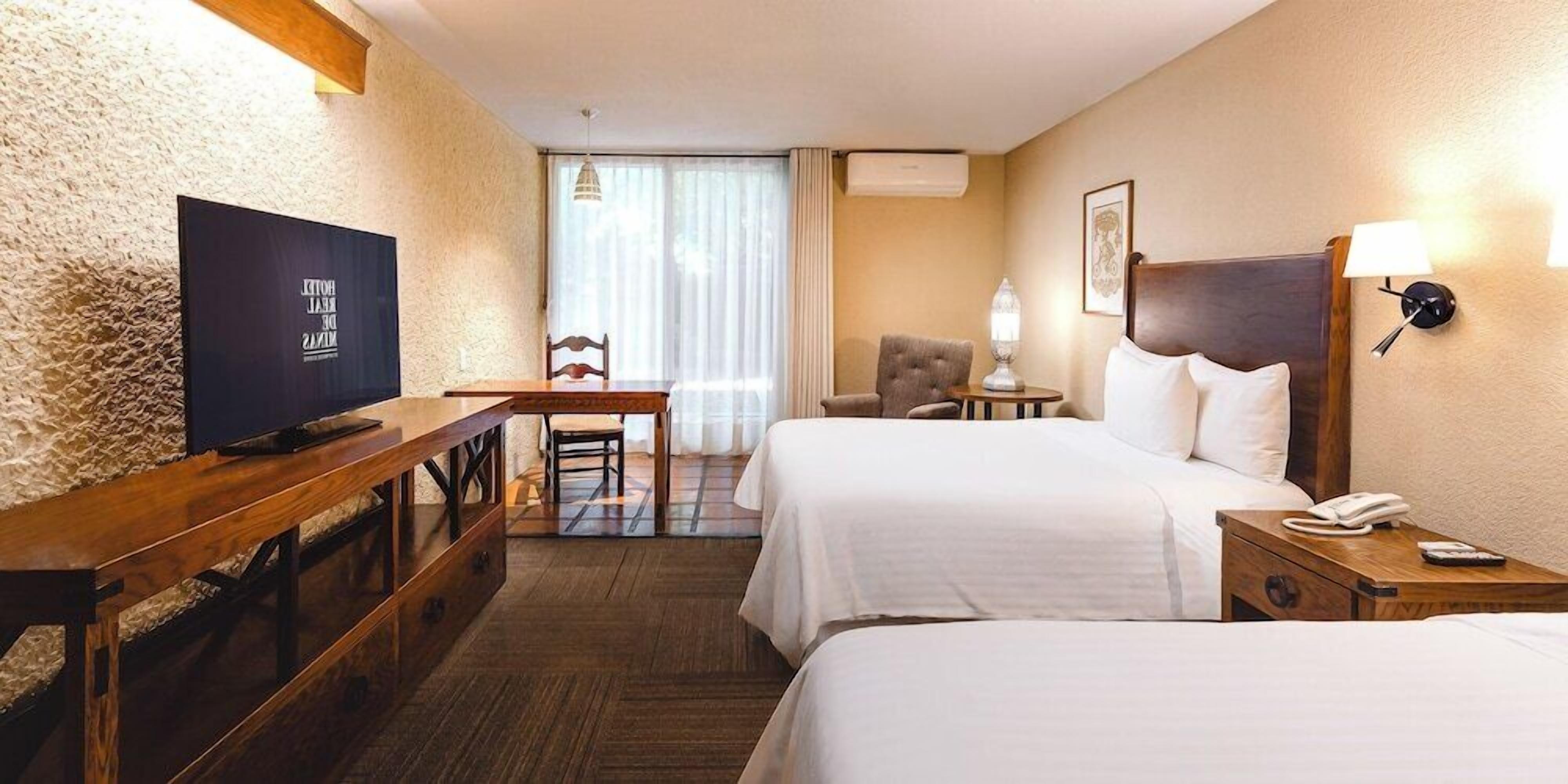 Premium bedding, down comforters, in-room safe, desk