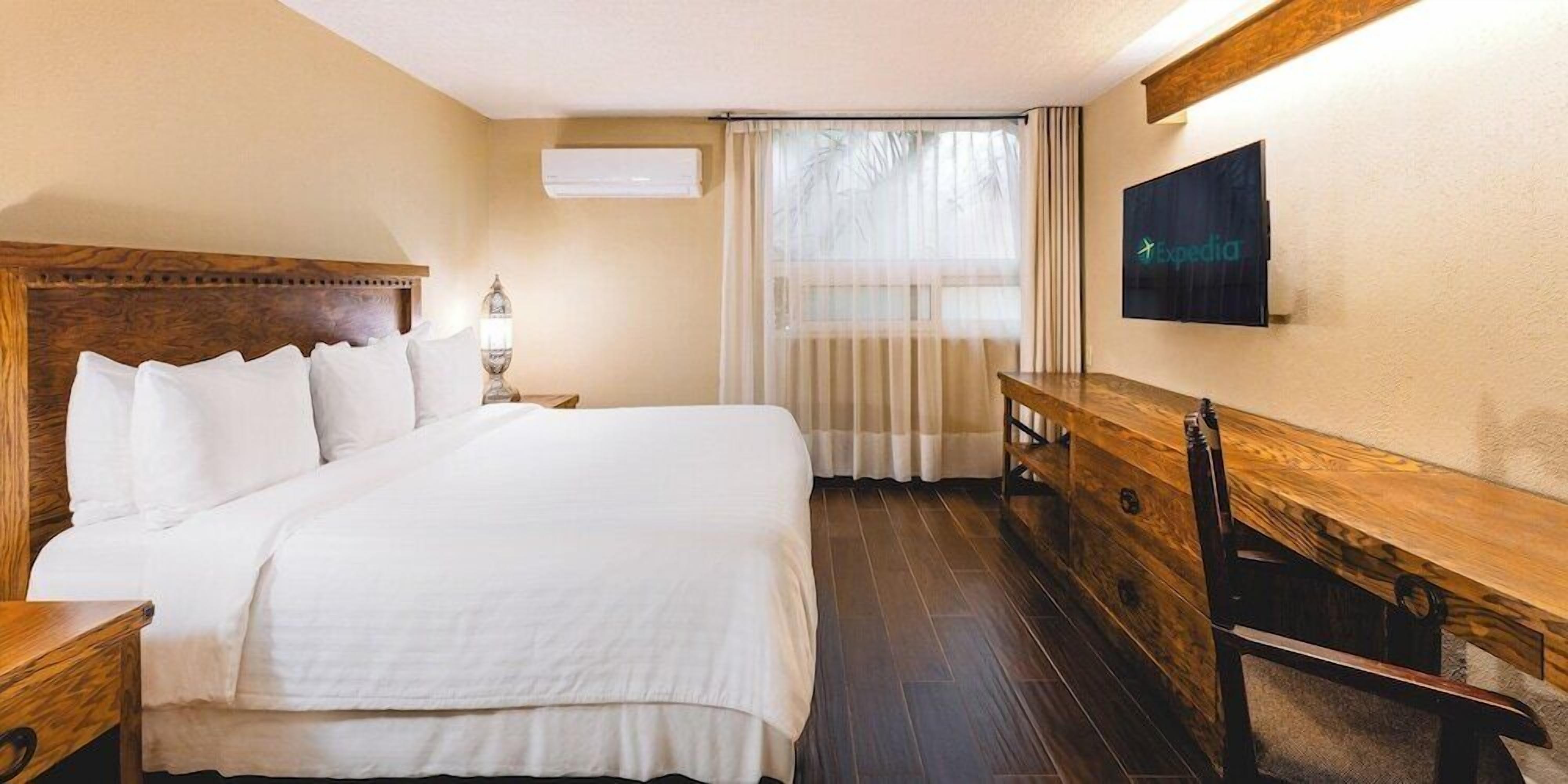 Premium bedding, down comforters, in-room safe, desk