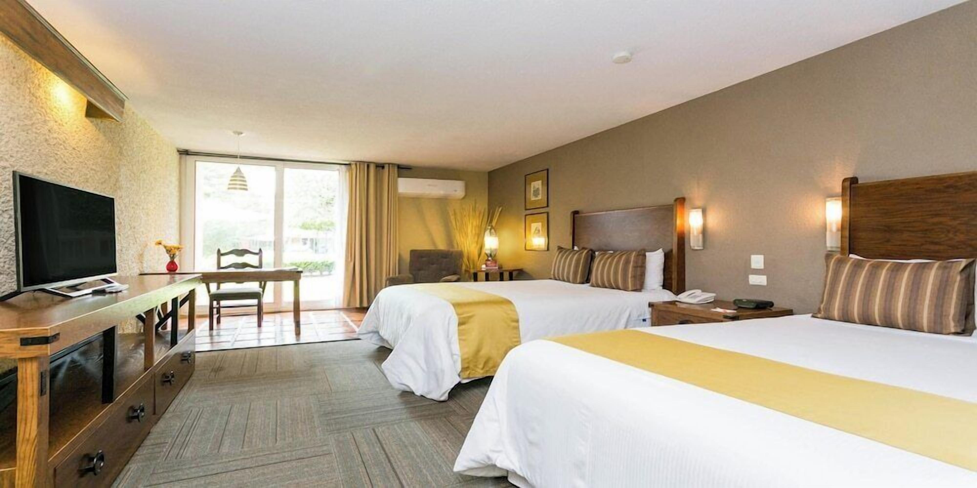 Premium bedding, down comforters, in-room safe, desk
