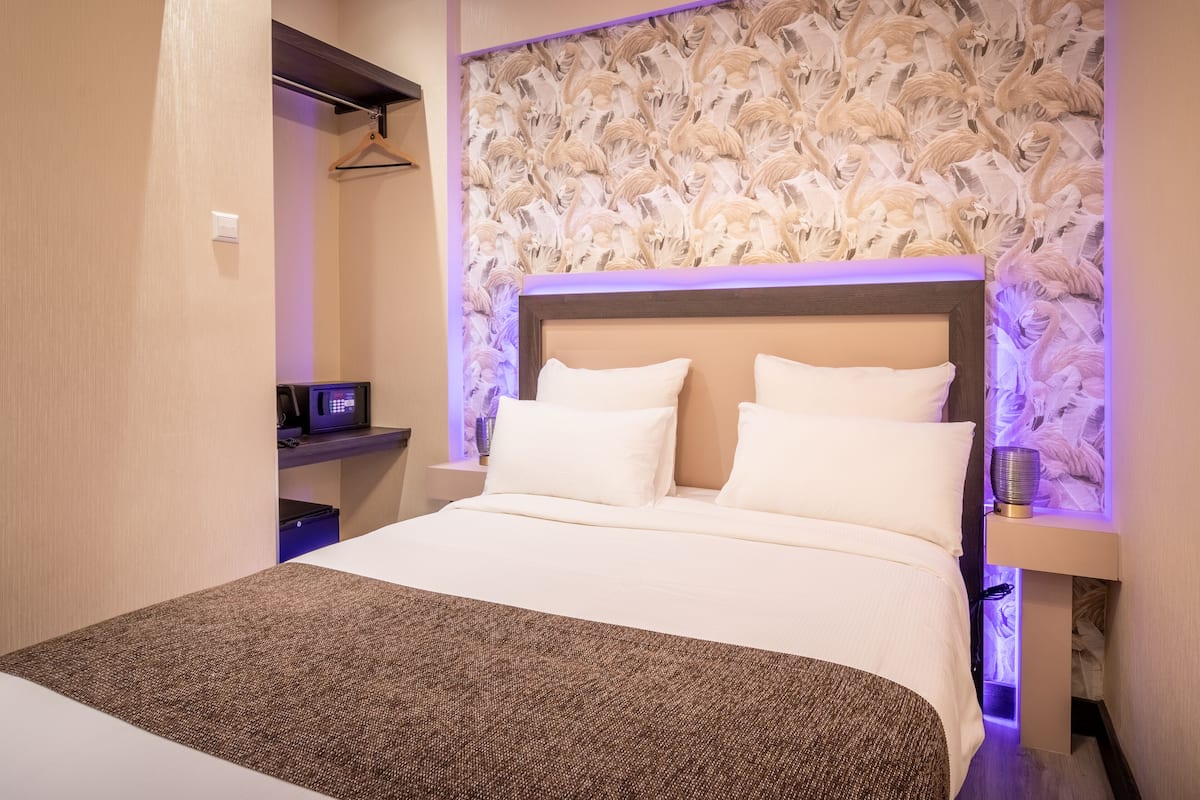 Singola Deluxe, 1 letto singolo | Minibar, una cassaforte in camera, una scrivania, tende oscuranti