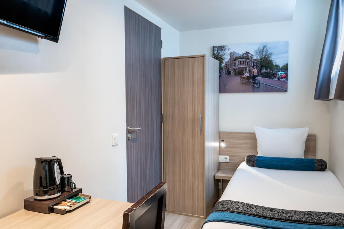Basic Single Room (Basement, Limited View) | Minibar, in-room safe, desk, iron/ironing board (on request)