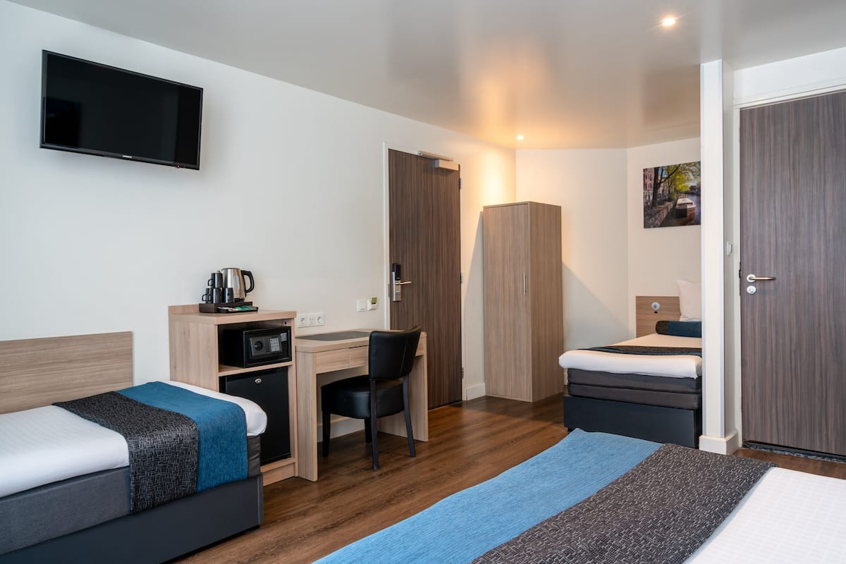 Quadruple Room | Minibar, in-room safe, desk, iron/ironing board (on request)