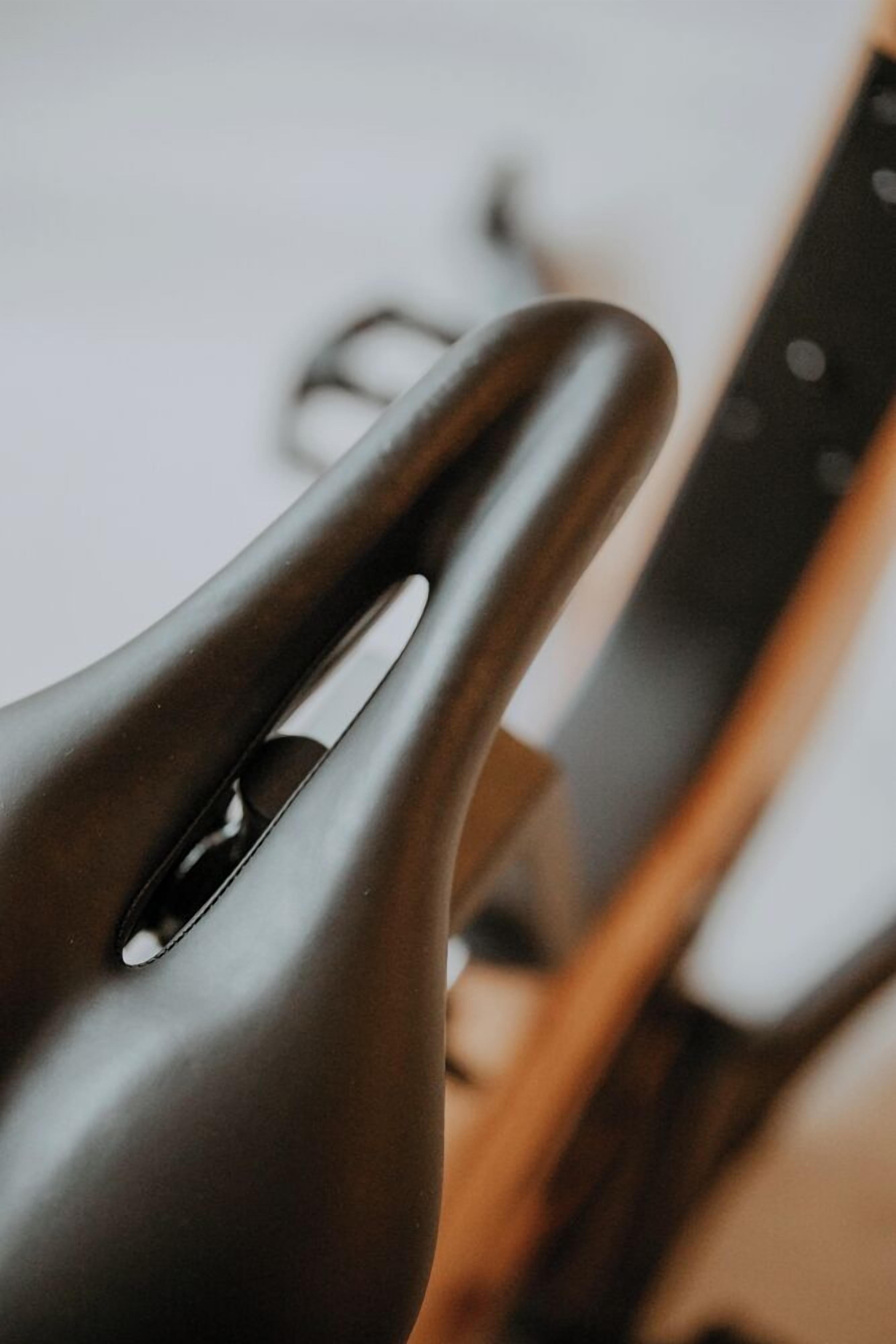 A close-up of a metallic object with a cutout, possibly a part of a larger item.