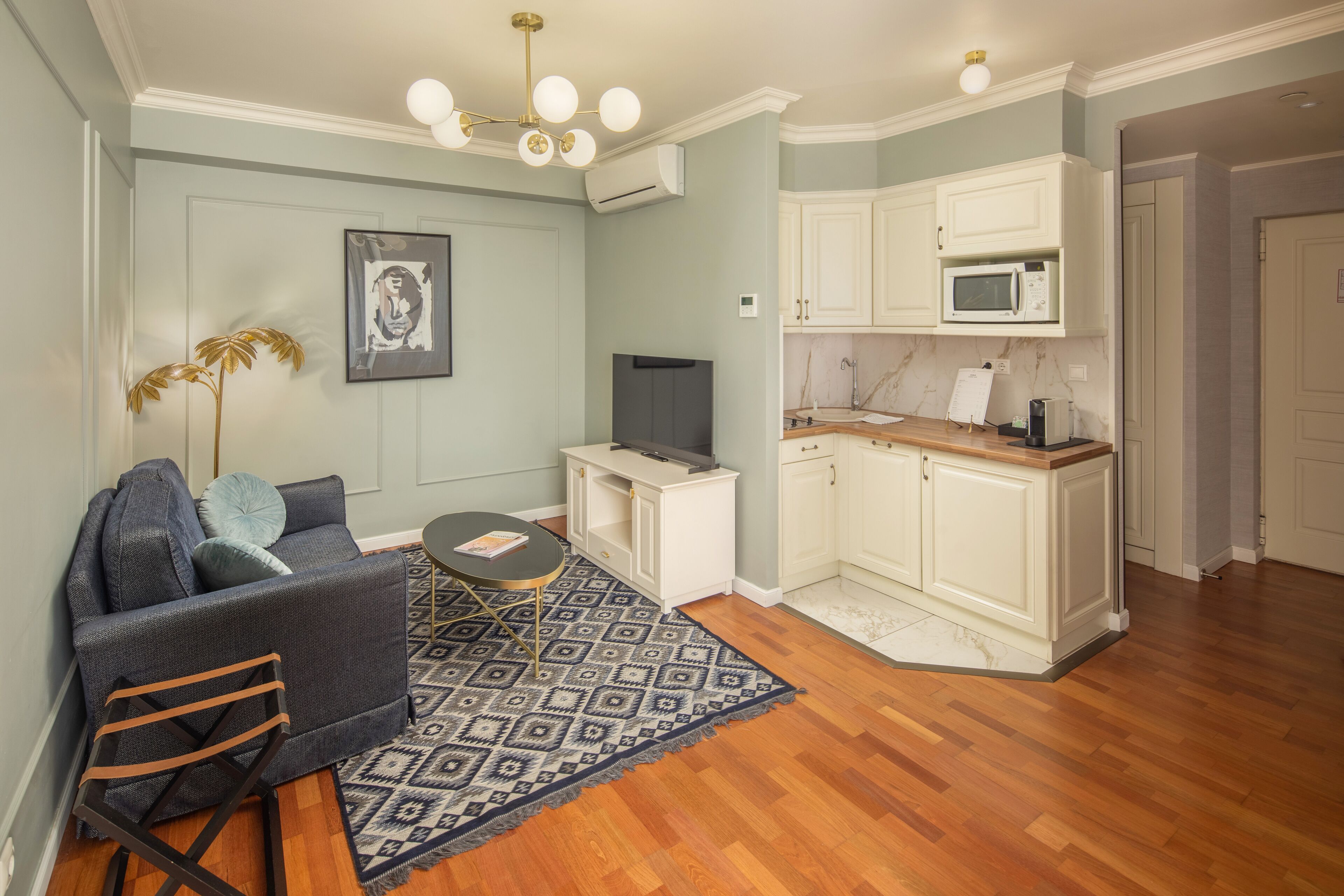 superior king suite | living area | 80-cm lcd tv with satellite channels, tv