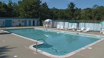 Seasonal outdoor pool, open 9:30 AM to 6:30 PM, pool loungers
