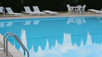 Seasonal outdoor pool, open 9:30 AM to 6:30 PM, pool loungers