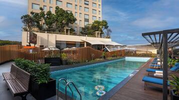 Outdoor pool, open 6 AM to 8 PM, free pool cabanas, pool umbrellas