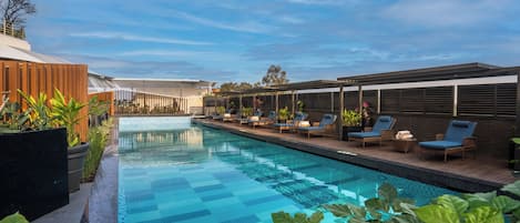 Outdoor pool, open 6 AM to 8 PM, free pool cabanas, pool umbrellas