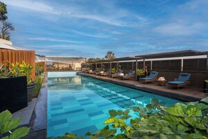 Outdoor pool, open 6 AM to 8 PM, free cabanas, pool umbrellas