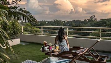 Guests can enjoy a peaceful outdoor setting with a lush landscape view from their balcony or terrace.
