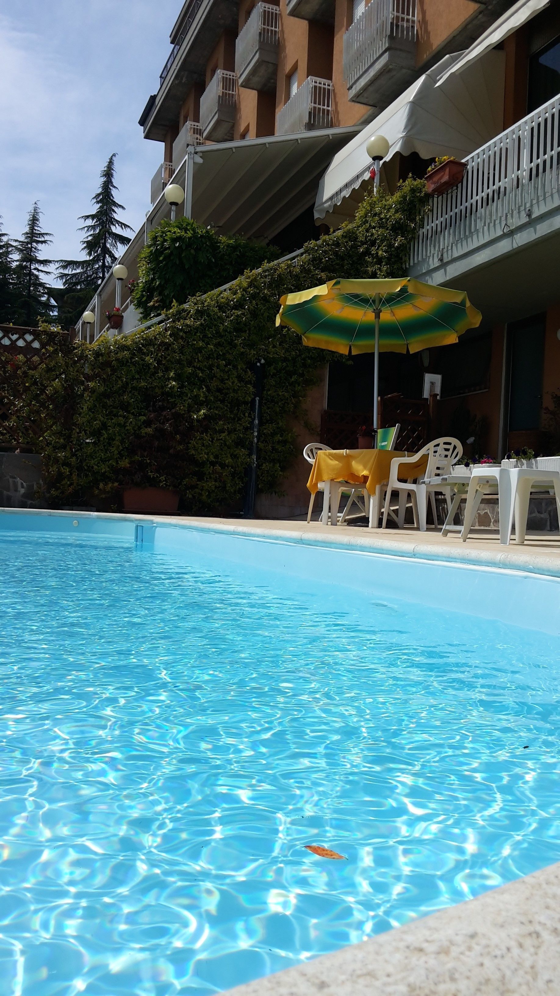 seasonal outdoor pool, pool umbrellas