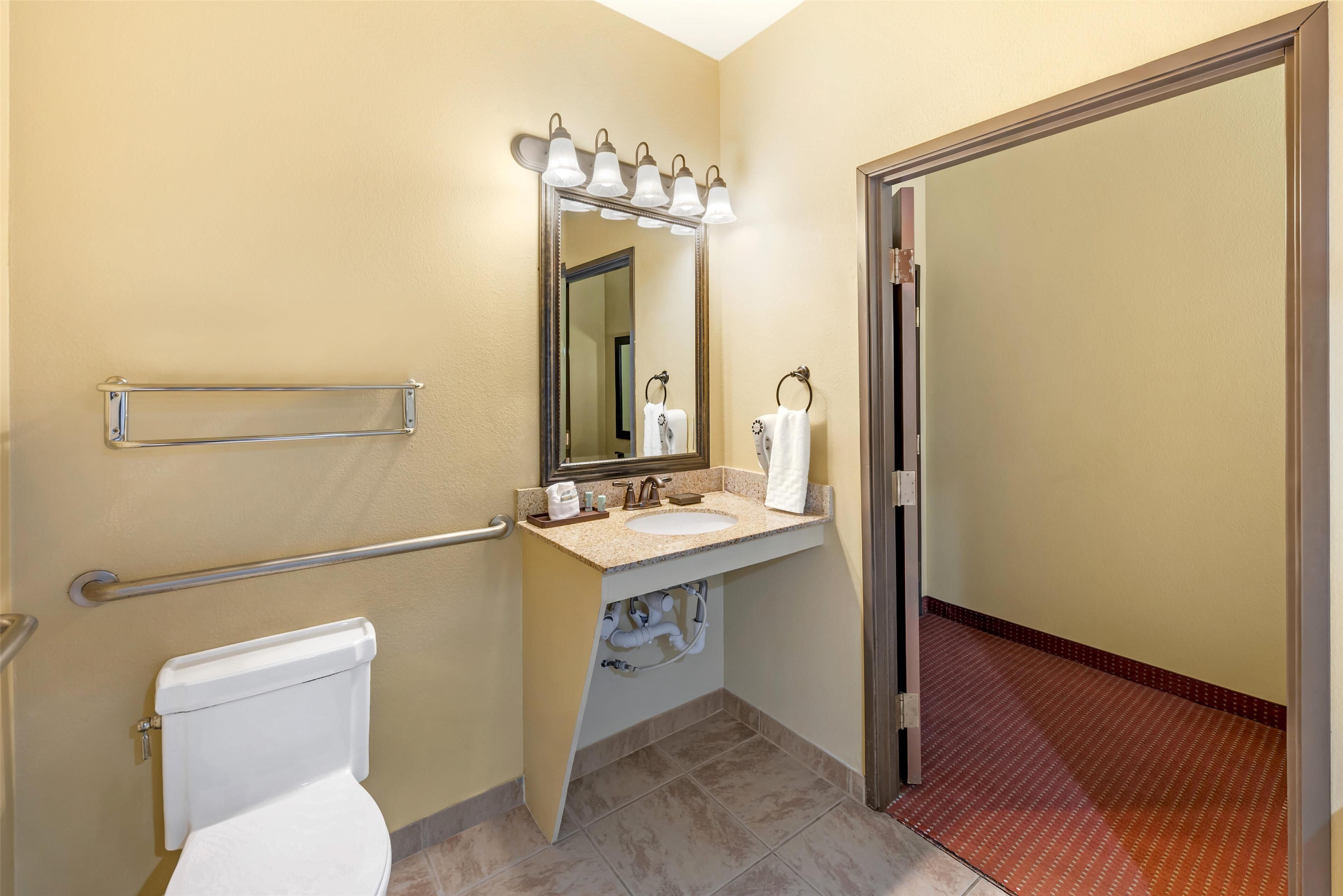 designer toiletries, hair dryer, towels