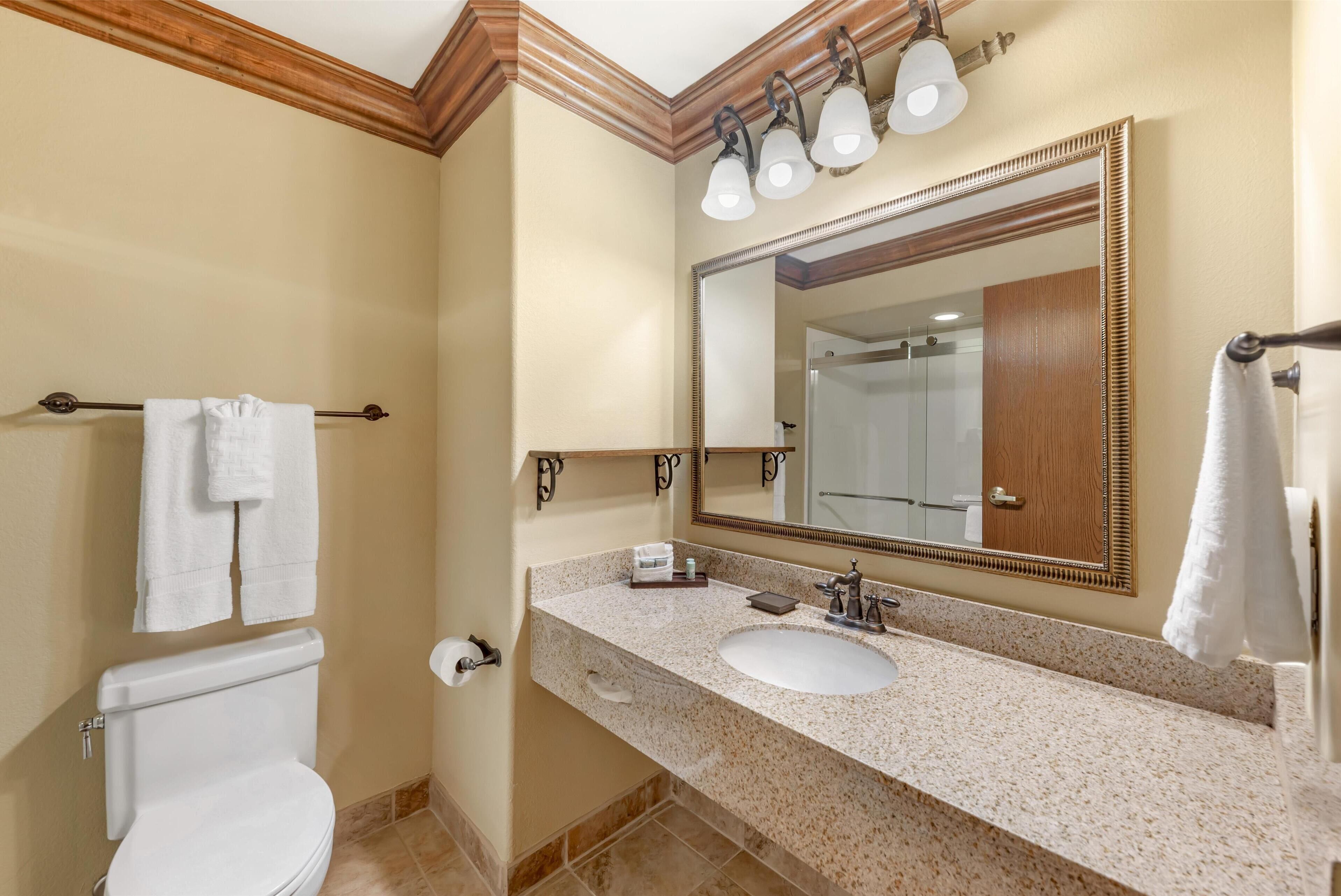 standard room, 1 king bed, non smoking, refrigerator & microwave | bathroom | designer toiletries, hair dryer, towels