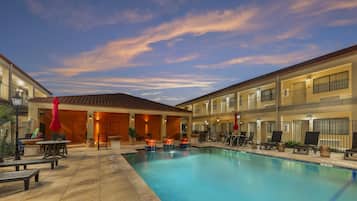 Outdoor pool, open 10:00 AM to 10:00 PM, pool umbrellas, pool loungers