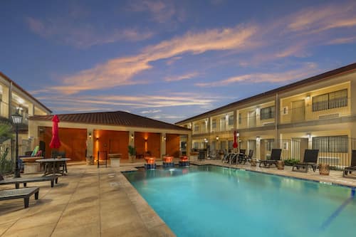 Outdoor pool, open 10:00 AM to 10:00 PM, pool umbrellas, sun loungers