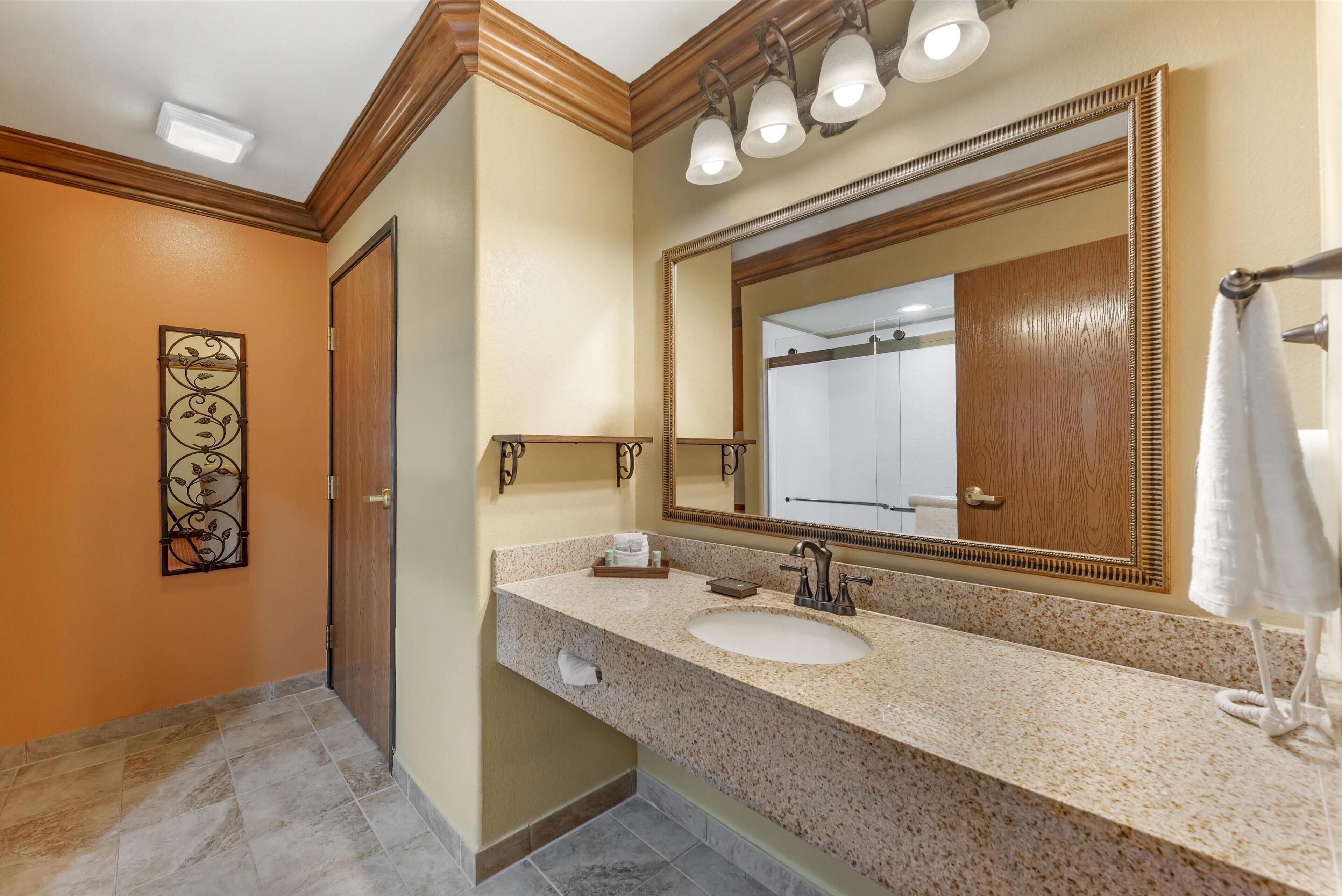 designer toiletries, hair dryer, towels