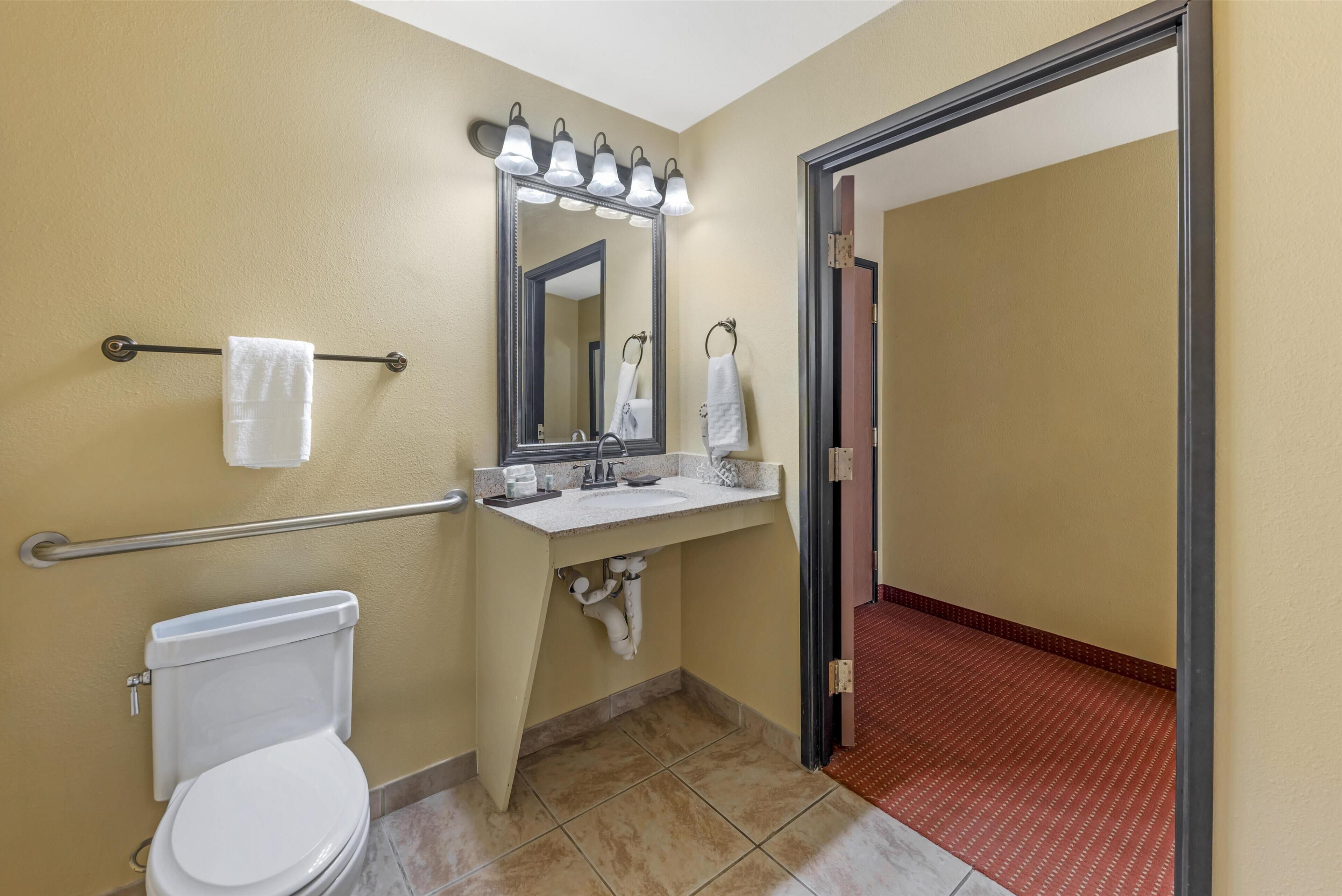 designer toiletries, hair dryer, towels