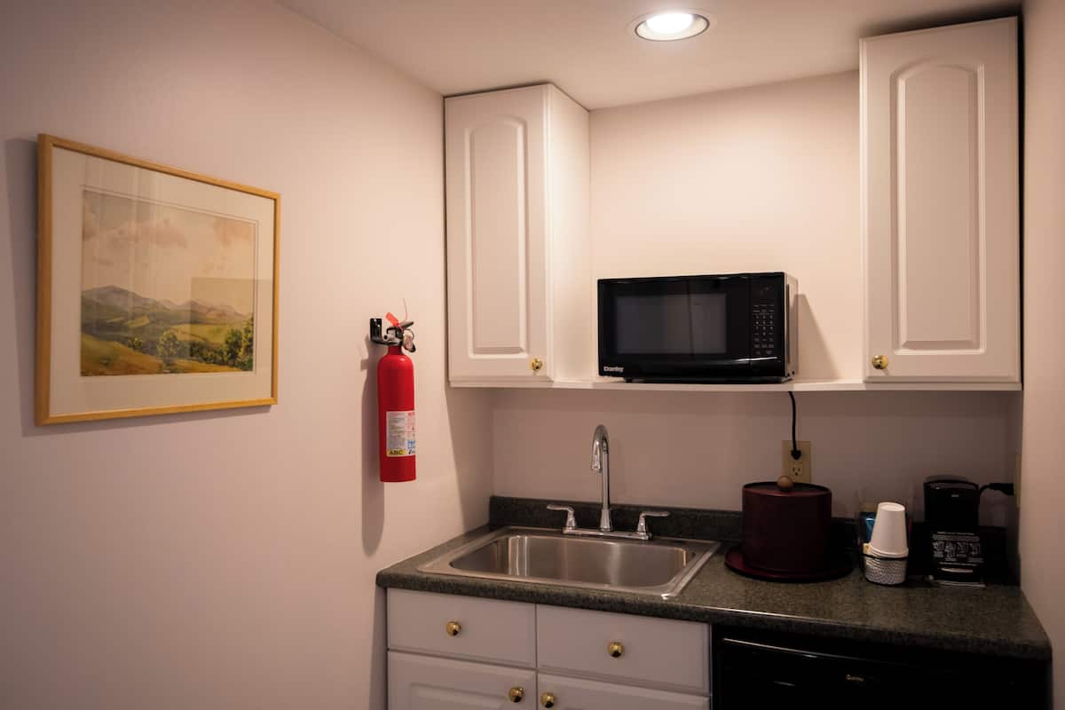 classic suite, 1 king bed | bathroom | eco-friendly toiletries, hair dryer, towels