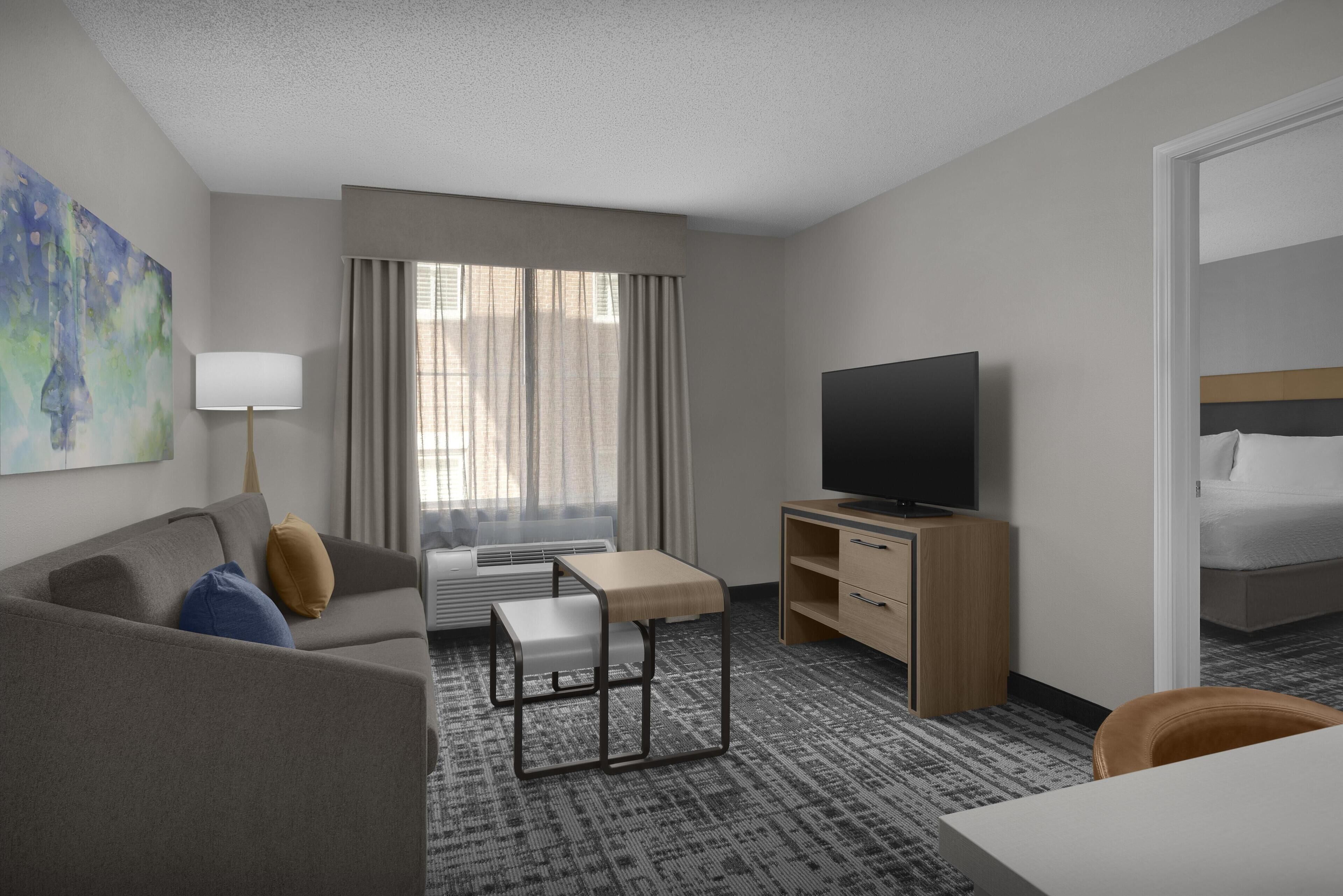 Suite, 1 King Bed with Sofa bed, Bathtub | Living area | 39-inch LCD TV with cable channels, TV, DVD player