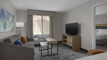 Suite, 1 King Bed with Sofa bed, Bathtub | Living area | 39-inch LCD TV with cable channels, TV, DVD player