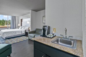 Suite, 1 King Bed | Desk, laptop workspace, blackout drapes, iron/ironing board