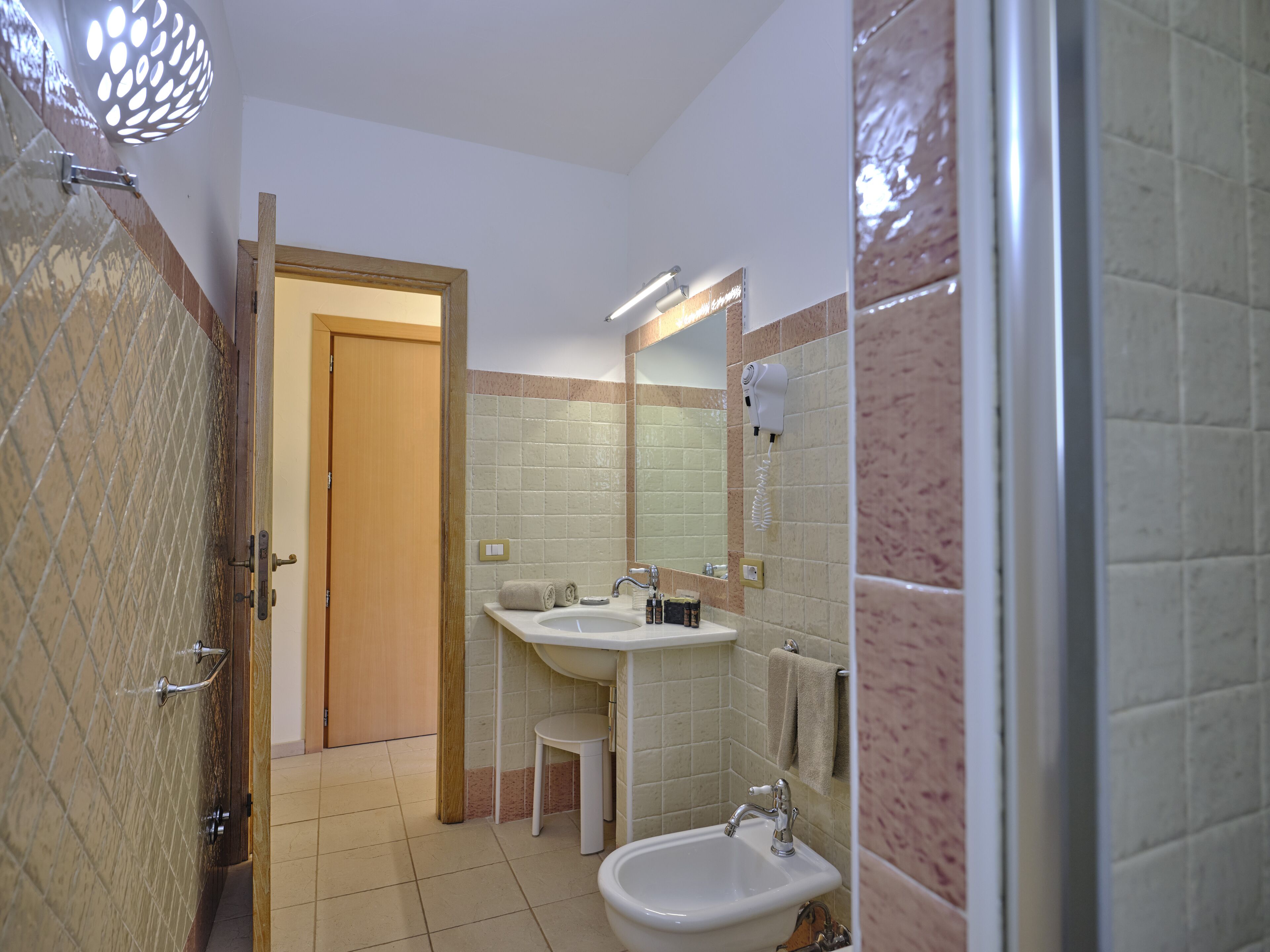 superior double room | bathroom | shower, rainfall showerhead, free toiletries, hair dryer