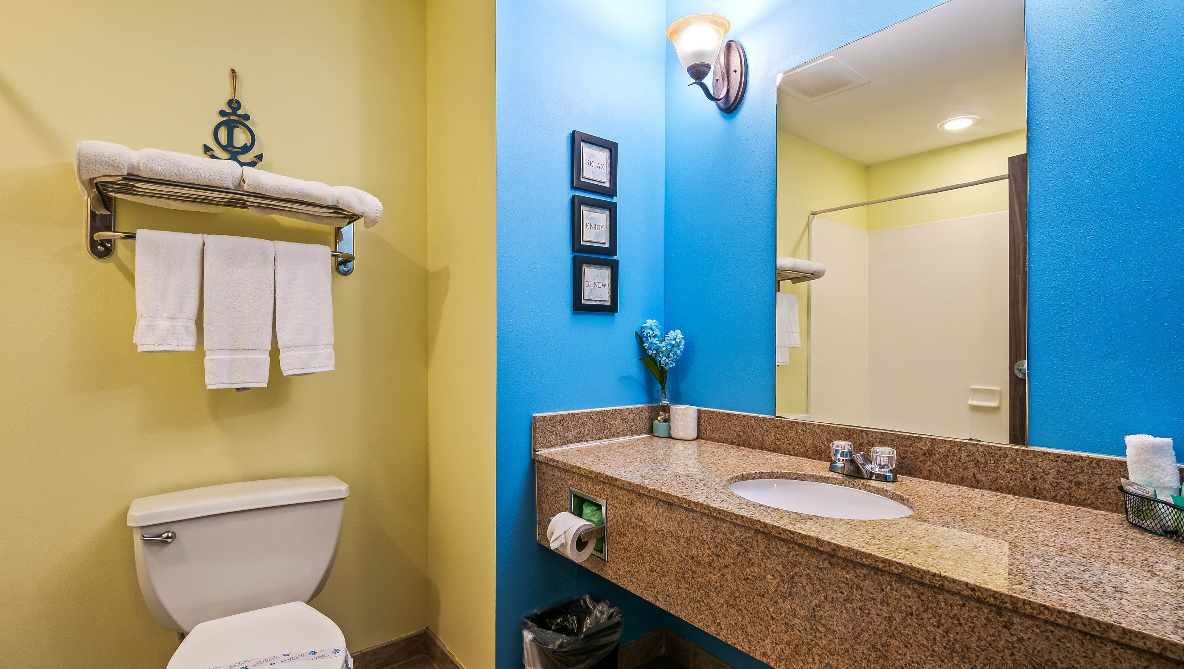 combined shower/bathtub, designer toiletries, hair dryer, towels