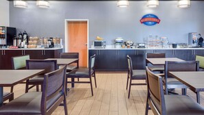 A breakfast area with seating and a counter.