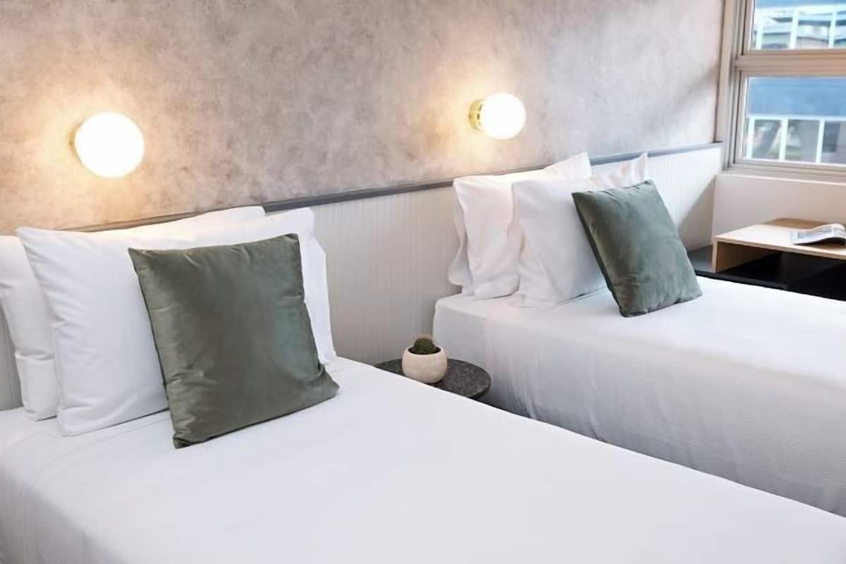 Minibar, desk, blackout curtains, bed sheets