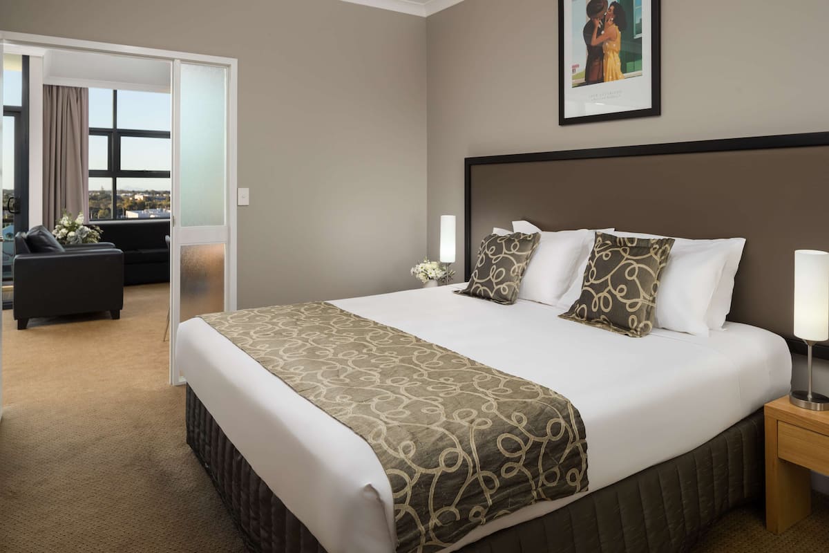 one bedroom suite | in-room safe, desk, blackout curtains, iron/ironing board