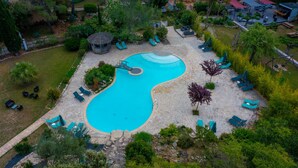 An aerial view of a resort with a swimming pool, lounge chairs, and a gazebo. - La Villa Vicha, The Originals Relais (Aubais)