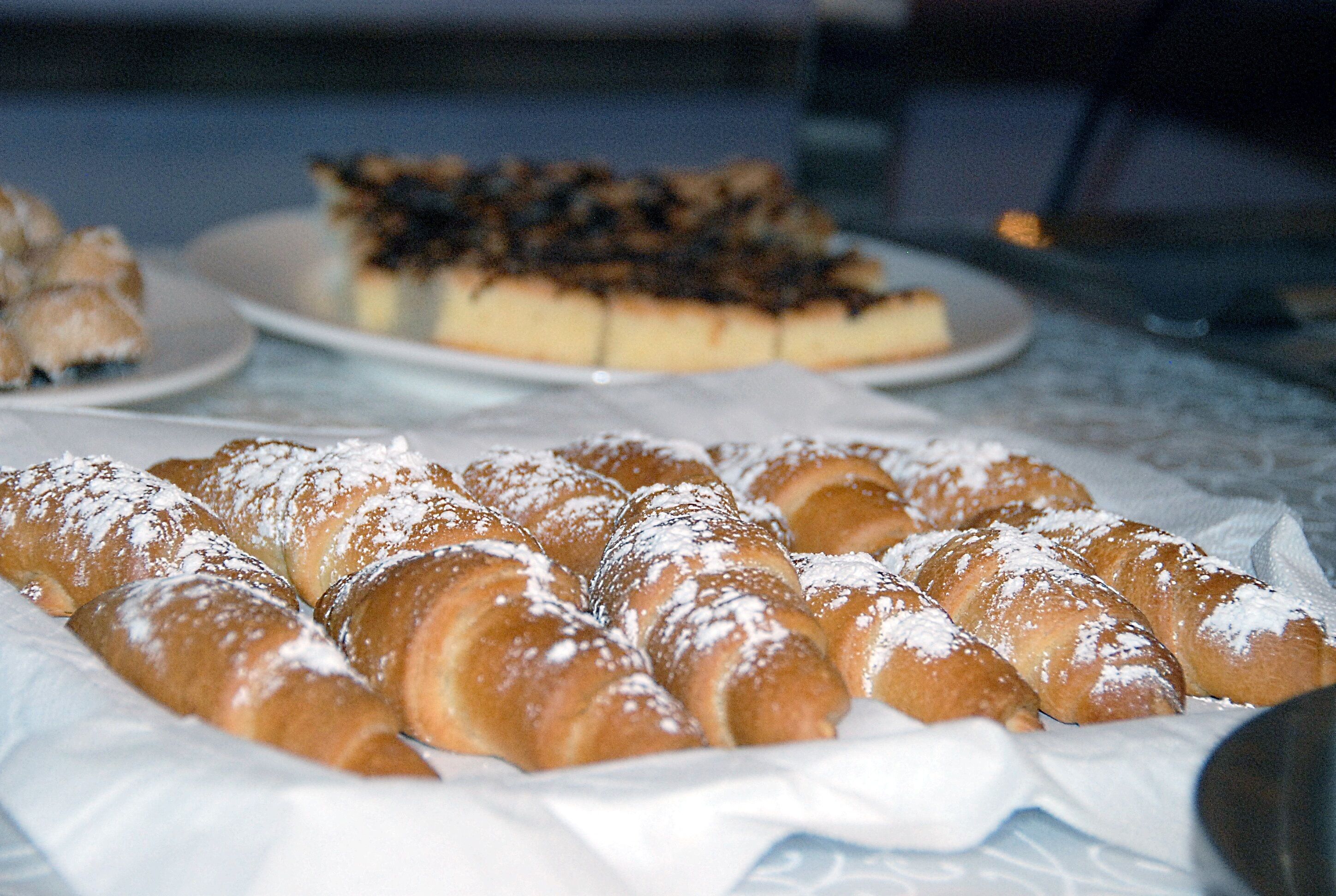 A table with pastries and desserts.