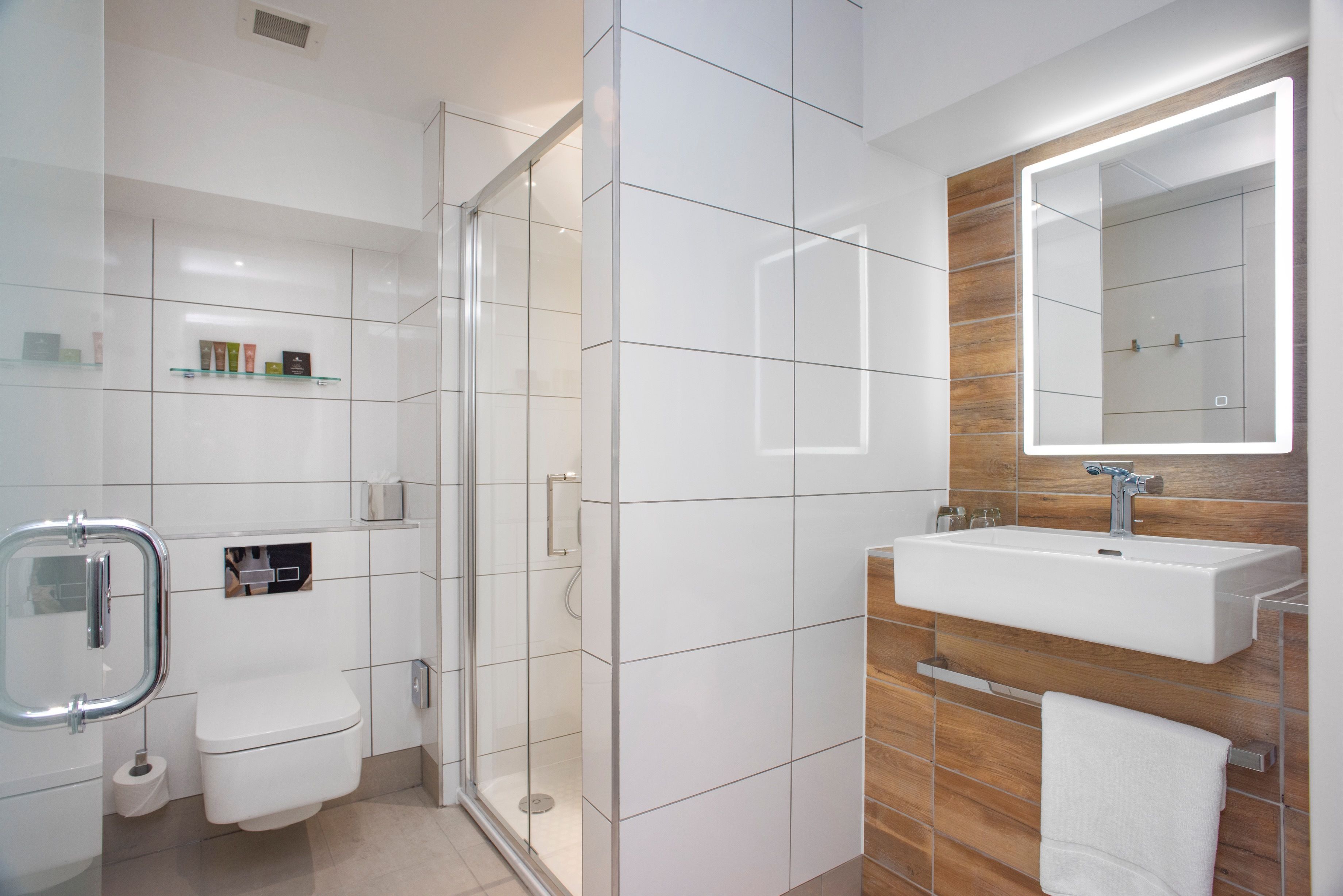 shower, designer toiletries, hair dryer, towels