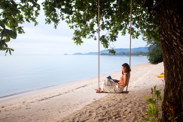On the beach, sun loungers, beach umbrellas, beach towels