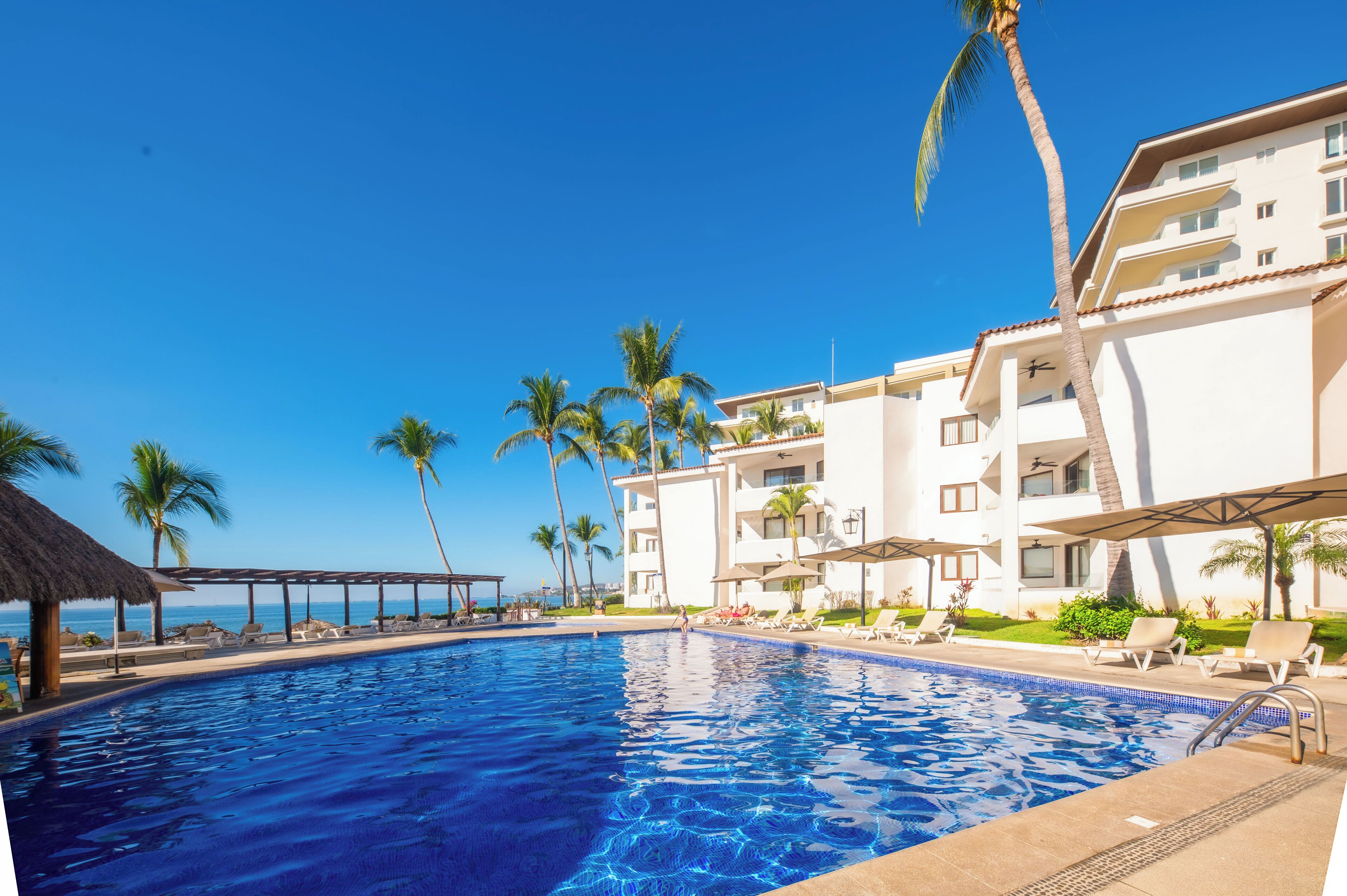 Outdoor pool, open 9:00 AM to 9:00 PM, pool umbrellas, pool loungers