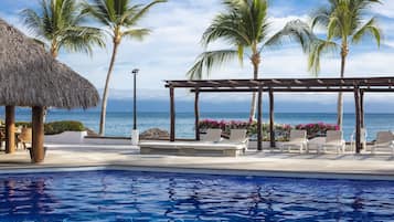 Outdoor pool, open 9:00 AM to 9:00 PM, pool umbrellas, pool loungers