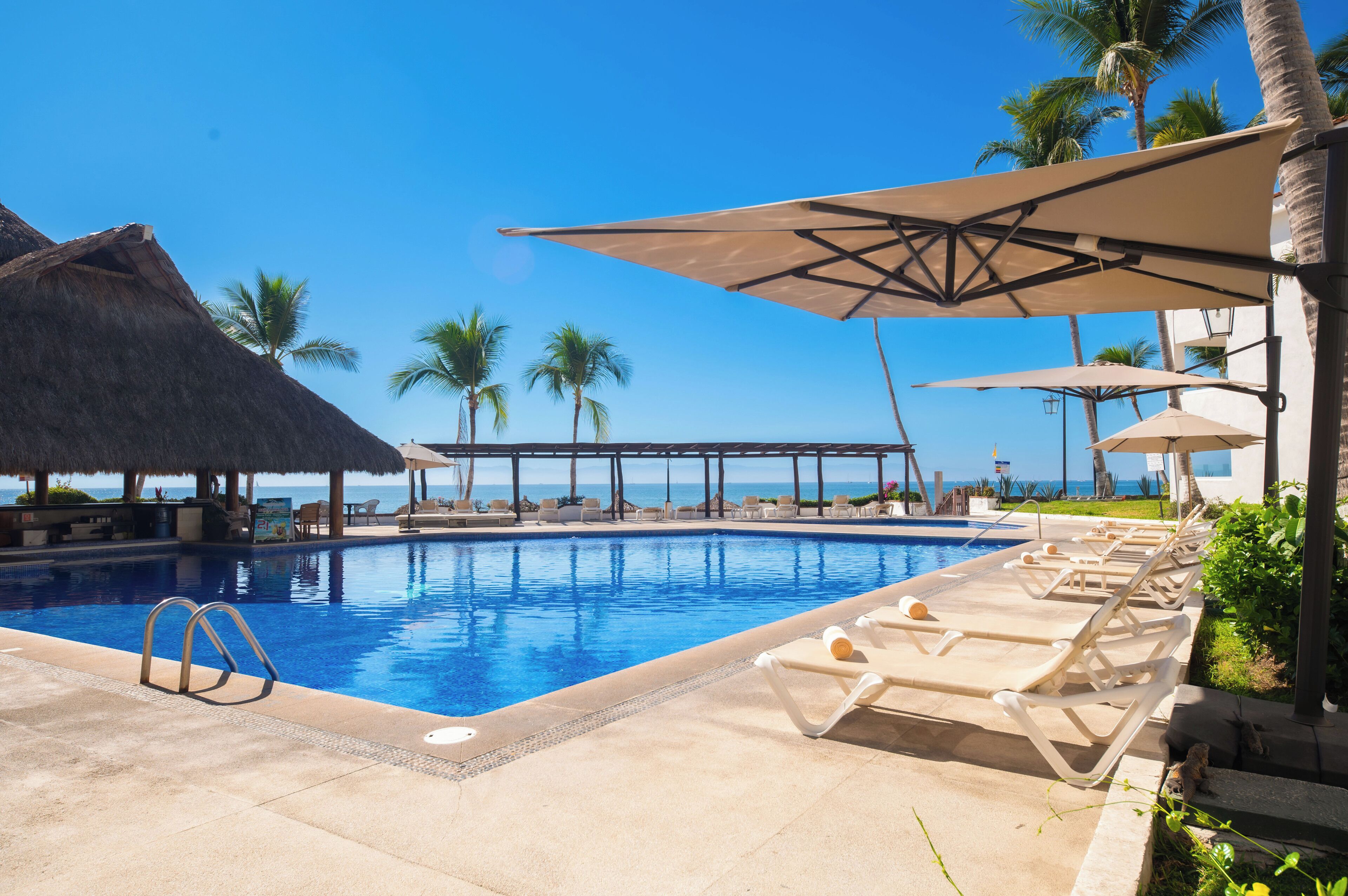 outdoor pool, open 9:00 am to 9:00 pm, pool umbrellas, pool loungers