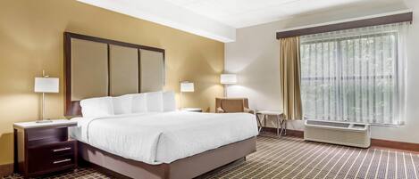 Deluxe Room, 1 King Bed, Non Smoking | Desk, laptop workspace, blackout curtains, iron/ironing board