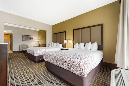 Suite, 2 Queen Beds, Non Smoking | Desk, laptop workspace, blackout drapes, iron/ironing board