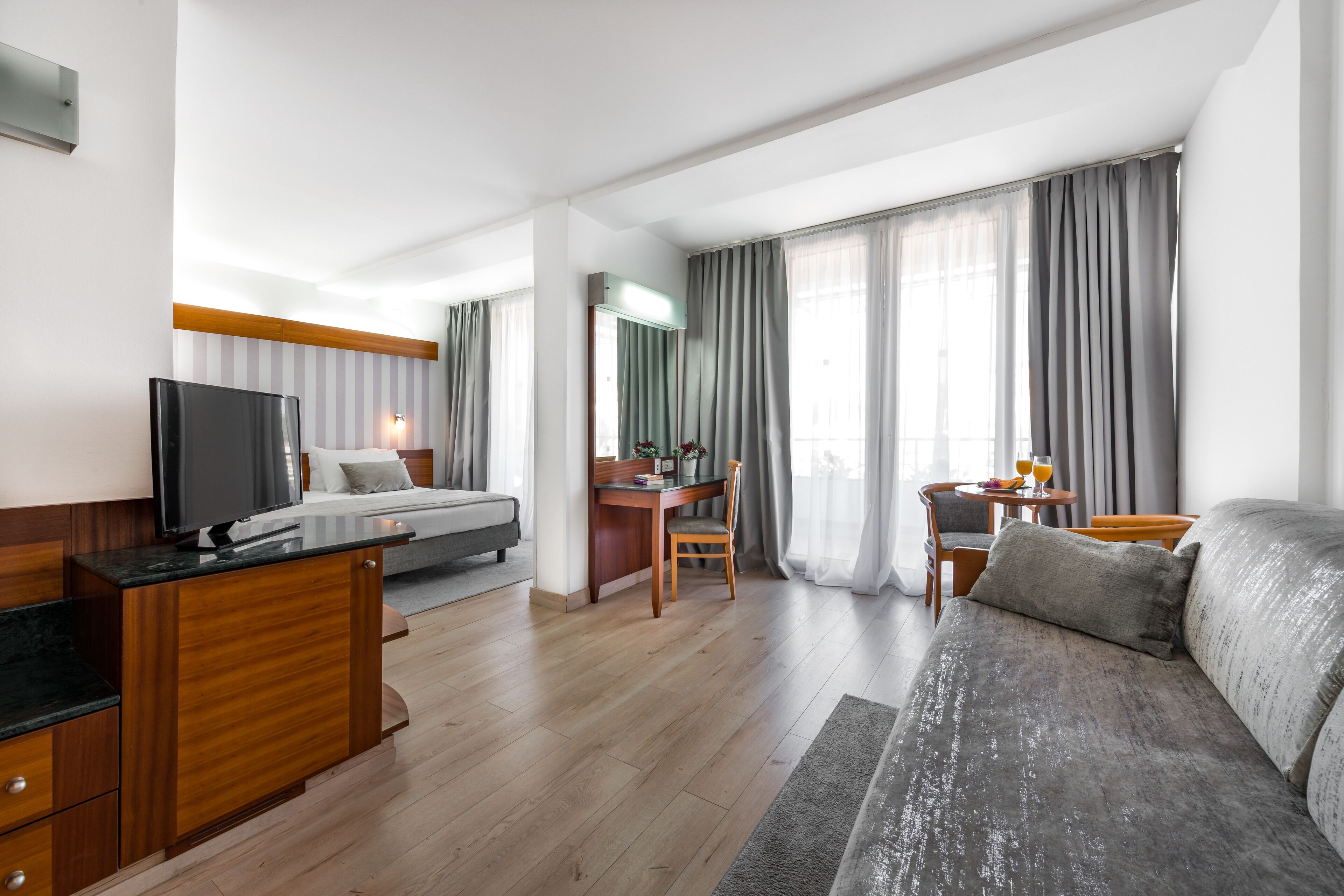 superior room, balcony, sea view | minibar, in-room safe, desk, blackout curtains