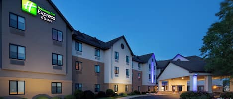 A Holiday Inn Express hotel with a modern design, multiple floors, and a well-lit entrance.