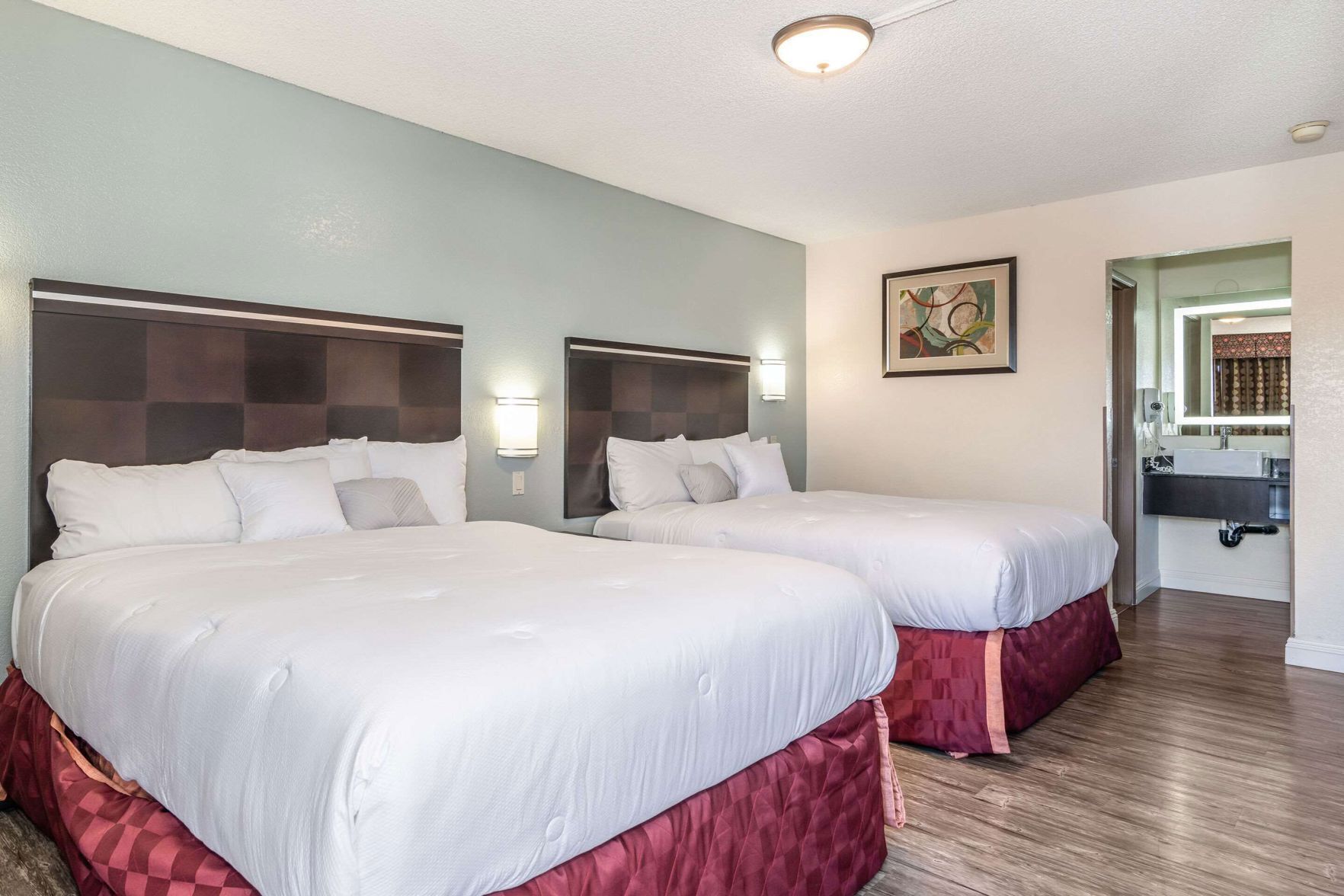 Pillowtop beds, desk, laptop workspace, blackout drapes