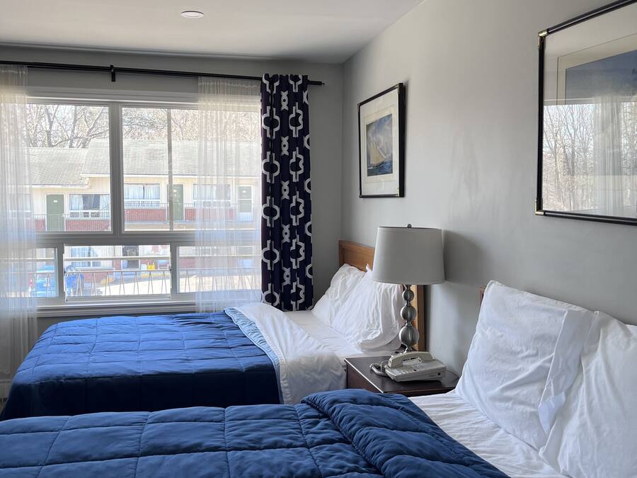 Room, 2 Queen Beds | Bathroom | Combined shower/bathtub, free toiletries, hair dryer, towels